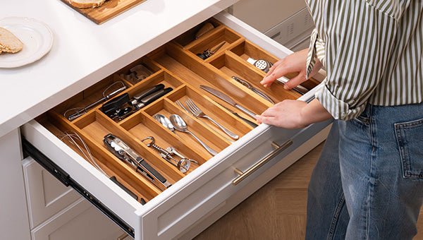 Bamboo drawer organizers that make kitchen drawers easier to use