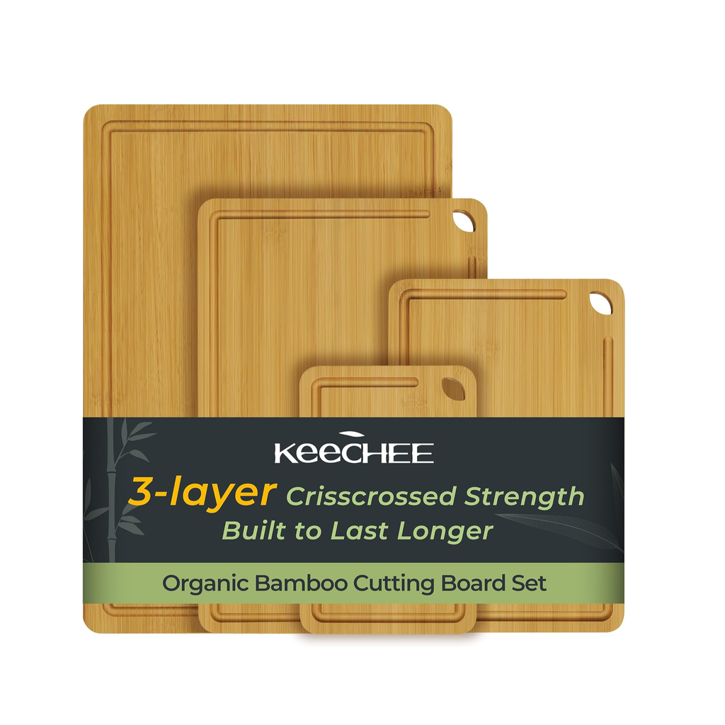 Four natural bamboo cutting boards with juice grooves and built-in handles