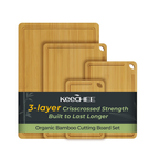 Four natural bamboo cutting boards with juice grooves and built-in handles