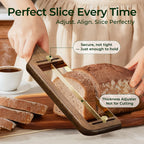 Walnut wood bread slicer cutting even slices from a sourdough loaf